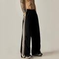 Black high-waisted wide leg straight trousers for men, made from polyester fibre.