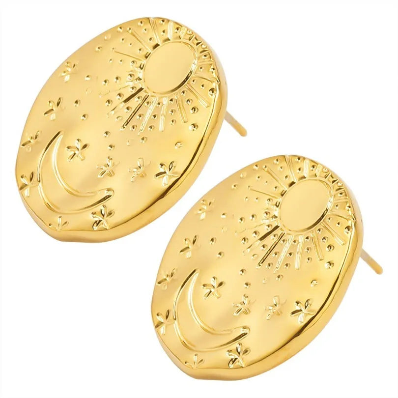 A pair of geometric shell design stud earrings in 304 stainless steel with a gold electroplated finish.