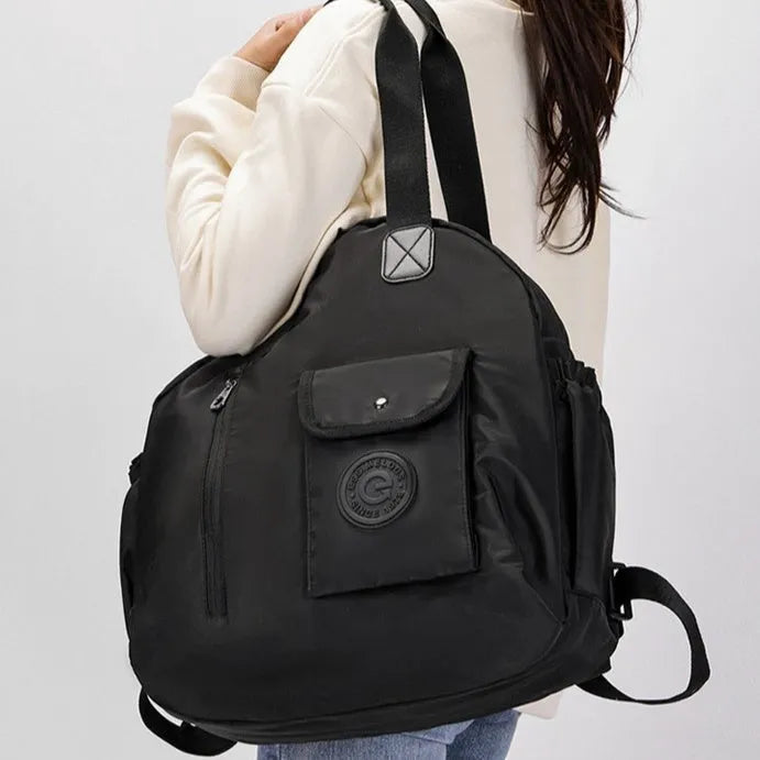 Large outdoor nylon backpack in black, shown with dimensions and sandwich pocket detail.