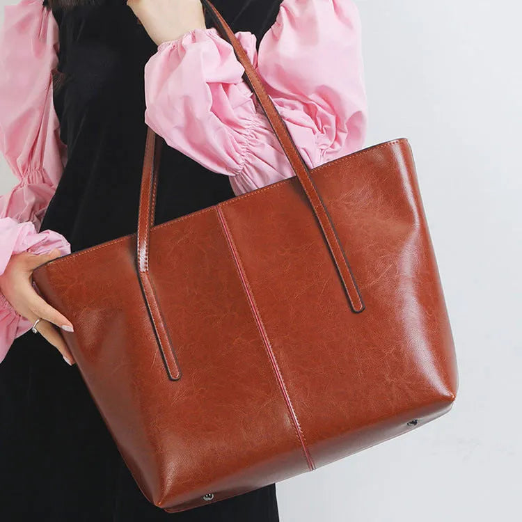 Women's soft cowhide leather shoulder bag in retro brown colour showing external slit pocket and single strap.