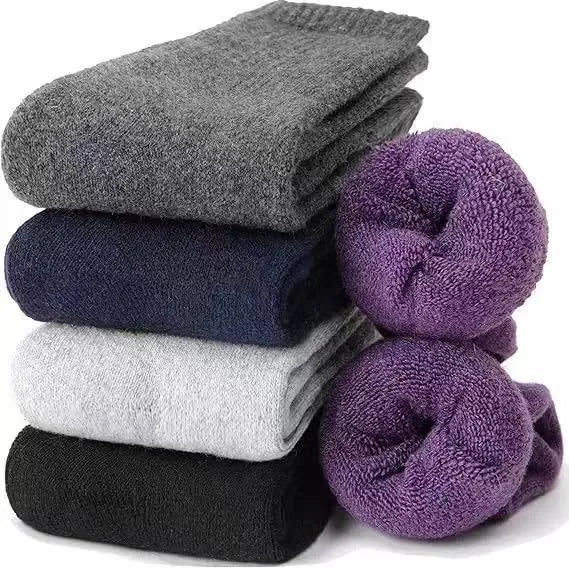 A pair of solid colour wool cashmere blend tube socks with a mid-calf length on a neutral background.