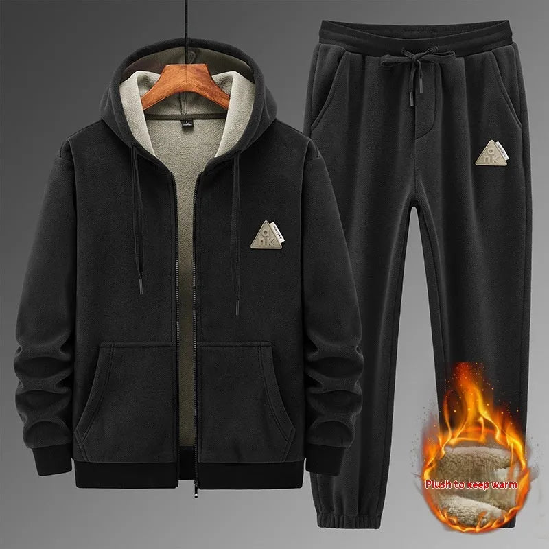 Grey hooded sweater and matching cotton trousers casual sport suit laid flat