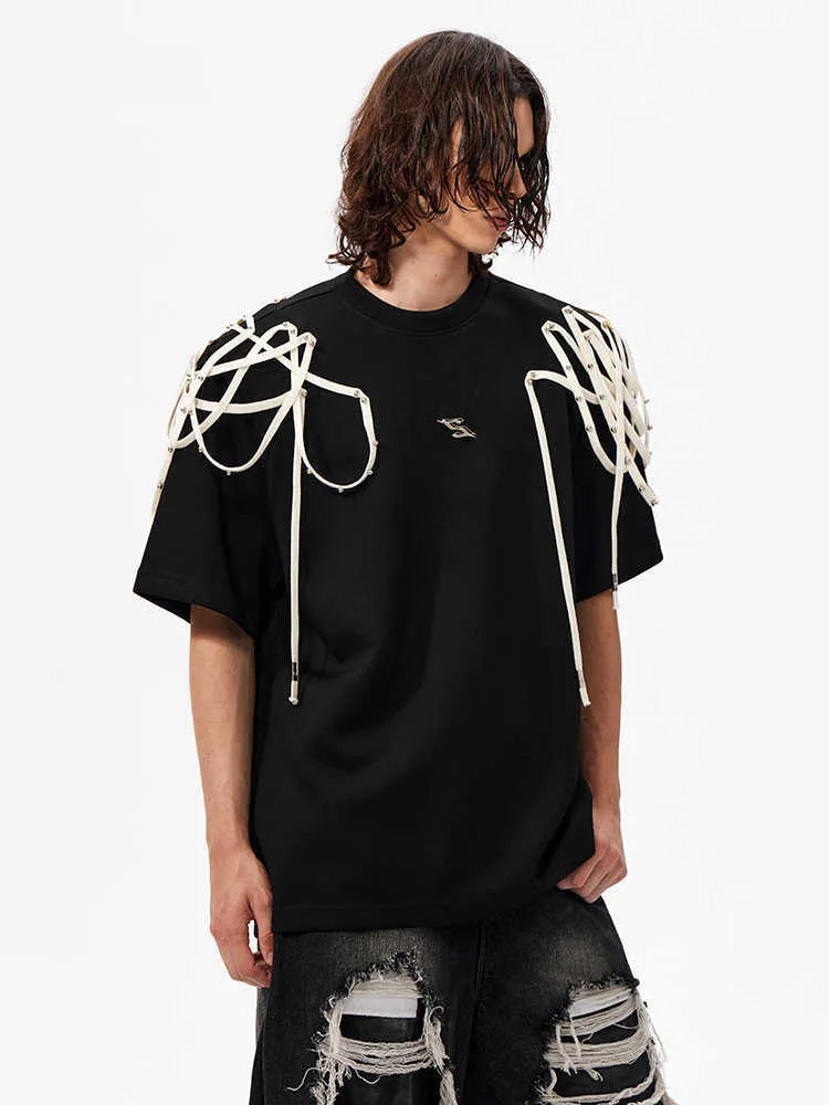 Black loose fit t-shirt with rivet ribbon detail on padded shoulders