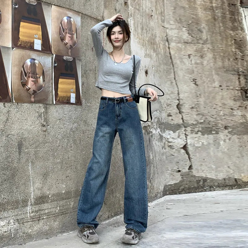 Women's retro blue high waist straight leg jeans on a hanger, showing the classic denim cut.