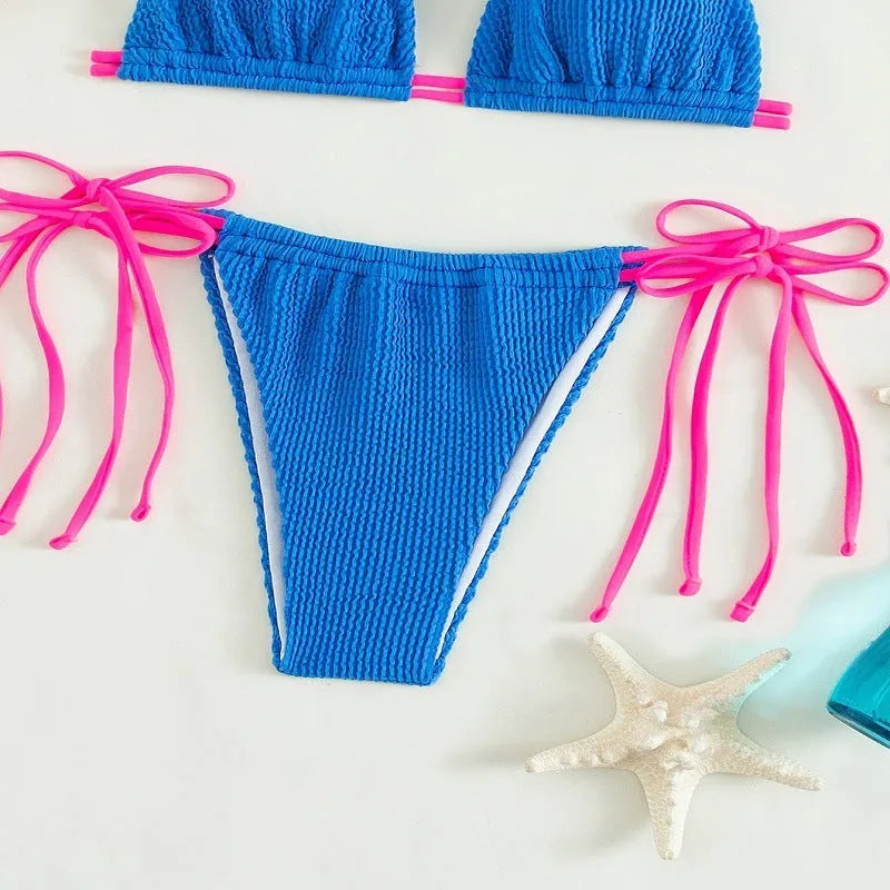 Women's black lace up bikini swimsuit set on a mannequin.