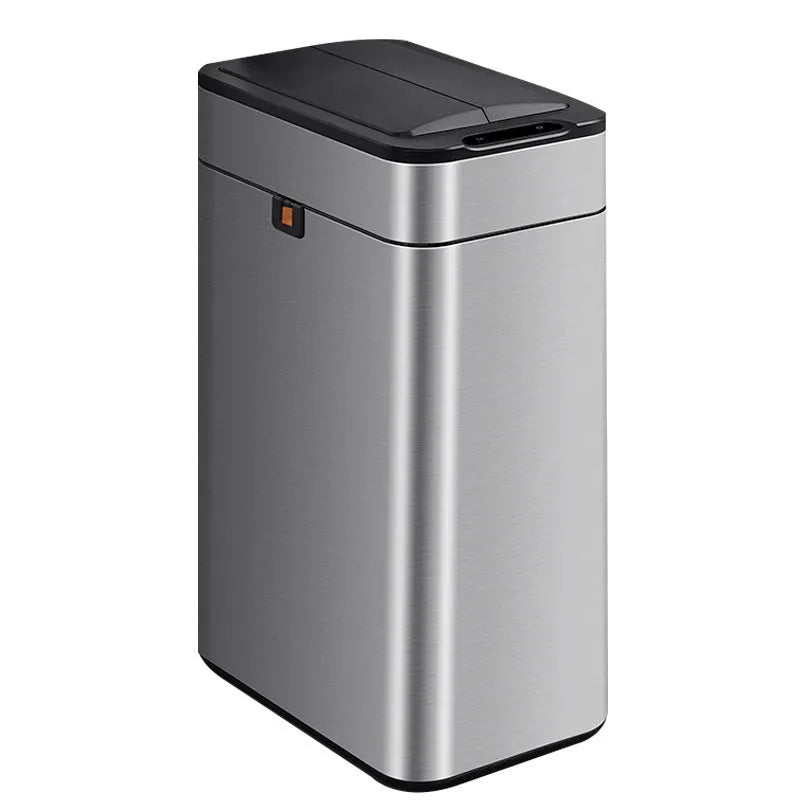 Stainless steel inductive smart trash can with square design on a kitchen floor.