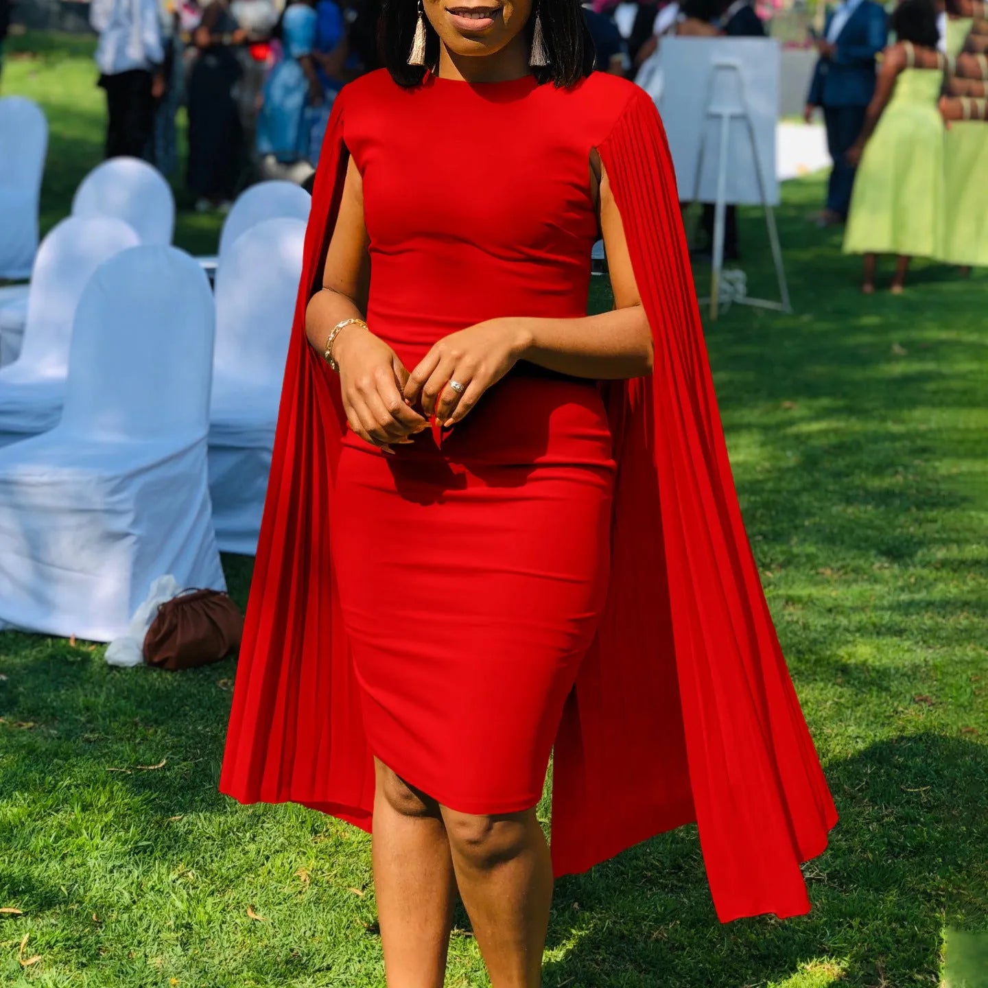 Long sleeve high waist pleated evening gown in yellow, orange, red, or green.