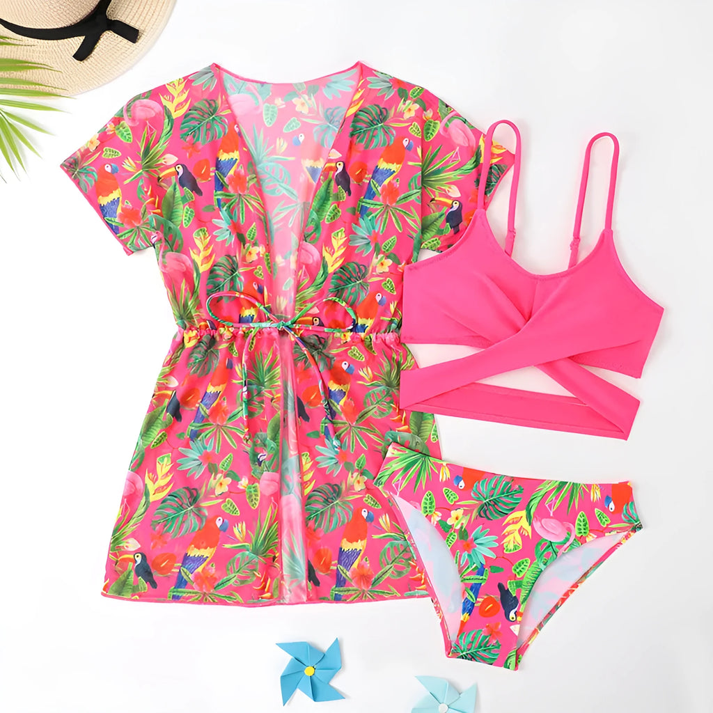 Girls floral print bikini swimsuit on hanger, showing two-piece design and overlay detail.