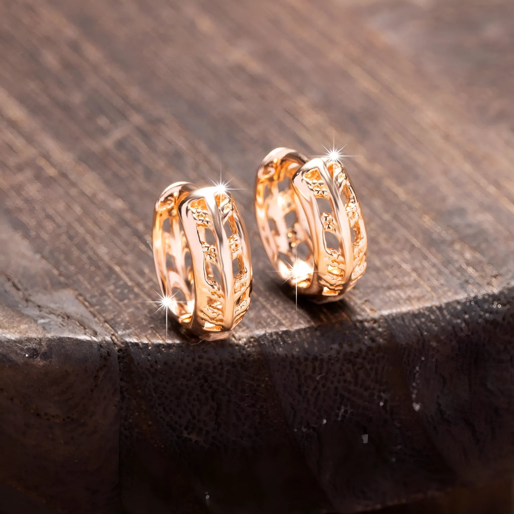 Rose gold copper earrings with hollowed-out leaf design featuring heart shape details
