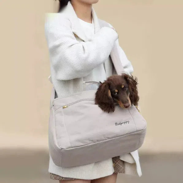 Crossbody bag for small breed dogs up to 10 jin in off-white colour on a neutral background