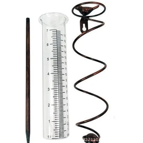 Cast iron garden rain gauge with decorative hummingbird design showing measurement scale