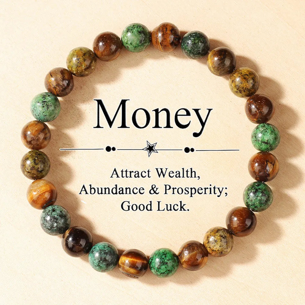 Handmade tigereye stone bracelet with 18mm flower-design beads on an adjustable strap.