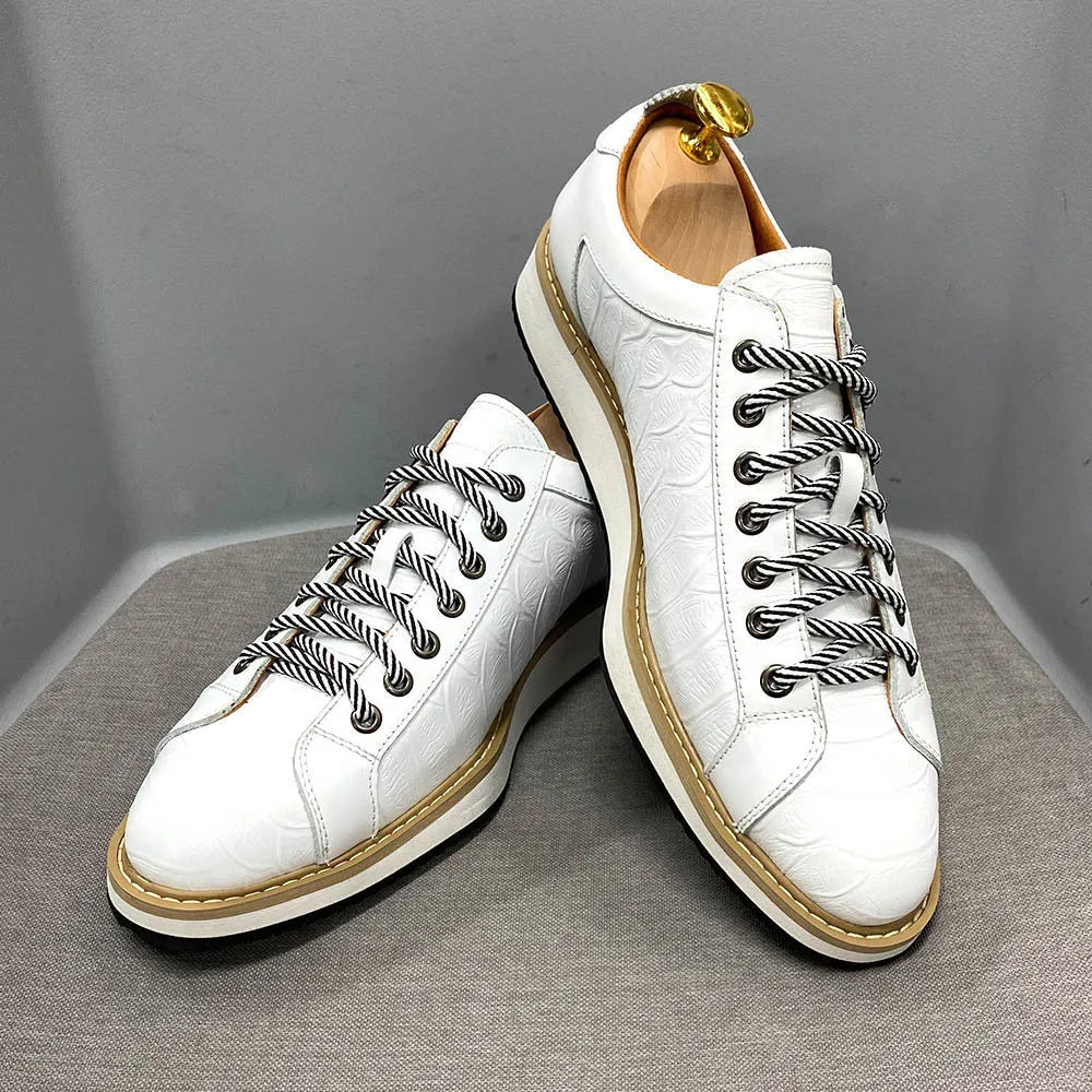 Men's low-top handmade shoes with an embossed pattern and front lace closure, shown in multiple colours.