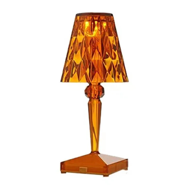 Rose gold portable touch night light with adjustable three-colour lighting on wooden surface