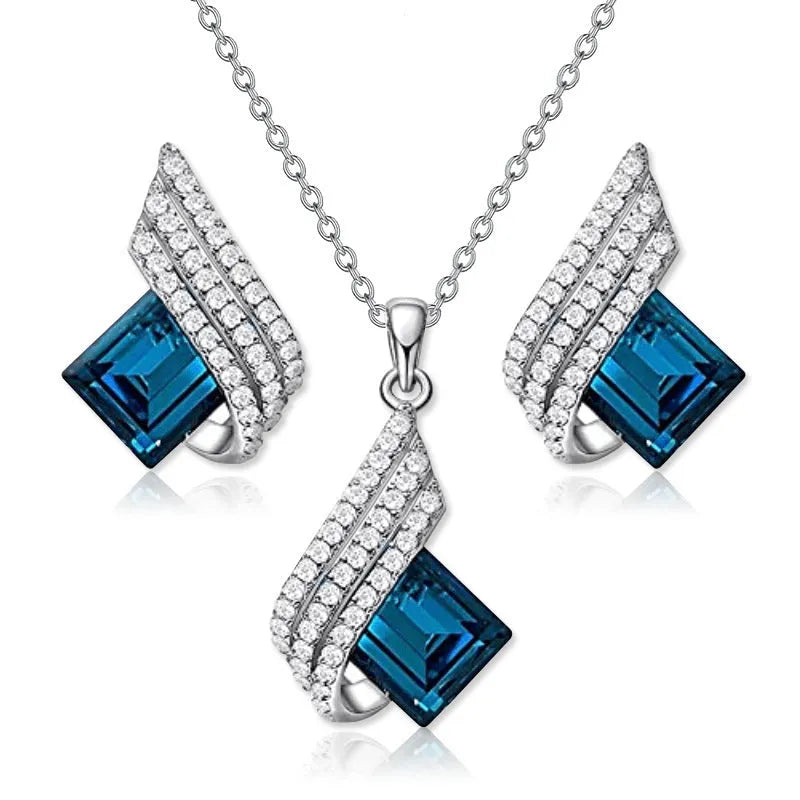 Fashion jewellery set showing alloy pendant necklace with cross chain and matching glass ear studs