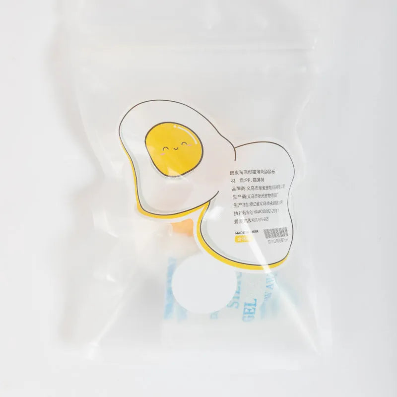 Catnip ball toy with suction cup attached to wall, showing Fried egg and Poached egg shape options