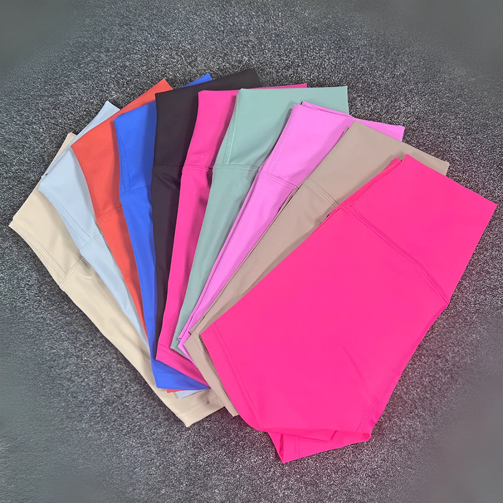 High-waisted women's yoga shorts in nylon fabric, shown in pink litchi colour.