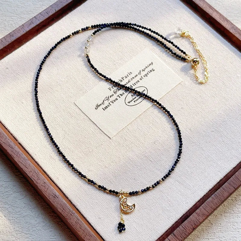 Women's blue sand stone and gold three-ring multi-layer bracelet on wrist