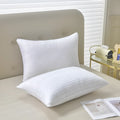 White hotel cotton satin stripe pillow with feather cotton filling shown in three size options.