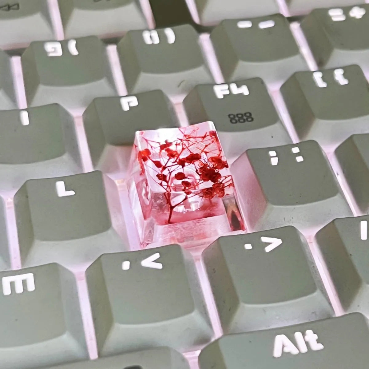 Transparent resin keycap with glitter particles creating starry night effect for mechanical keyboards