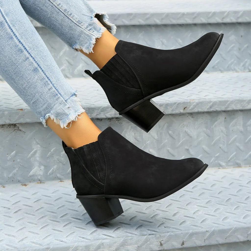 Women's black ankle boots with pointed toe and thick square low heel for autumn winter wear