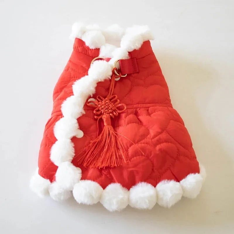 Red Chinese style pet clothing with a thick fur collar and traditional knot decoration on a dog or cat.