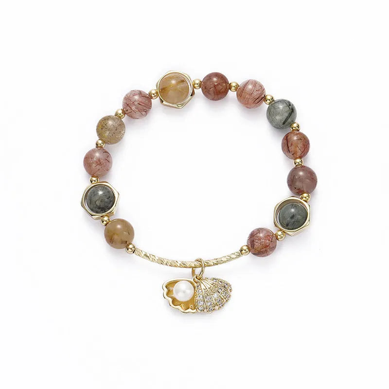 Women's crystal bracelet with coloured hair crystal shells and red sealant flower shells on wrist
