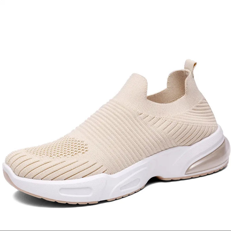 Slip-on breathable sock shoes in black, pink, khaki, and white colours on a white background.