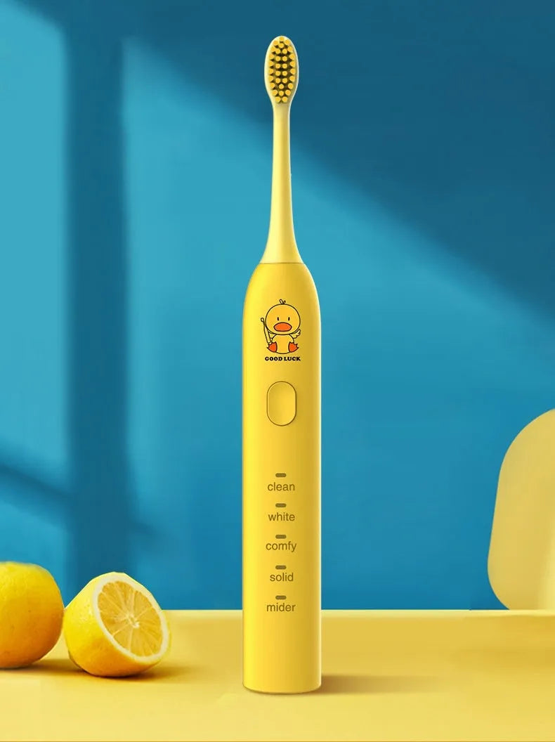Small yellow duck design rechargeable electric toothbrush with soft bristles.