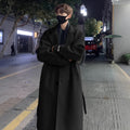 Men's British style mid-long wool coat in khaki with side seam pockets on a hanger