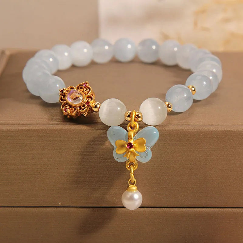 Women's aquamarine butterfly pendant bracelet with crystal and rhinestone details