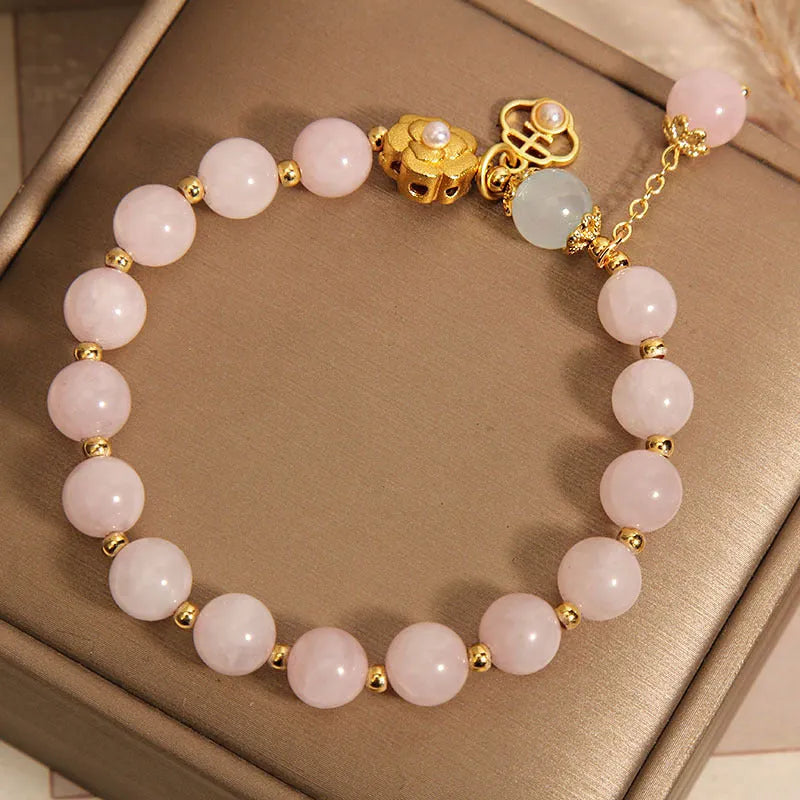 Women's pink crystal flower bracelet showing floral arrangement of stones on wrist