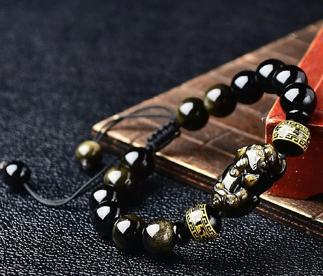 Natural golden obsidian Pi Xiu bracelet with hand-woven cord, showing four bead size options