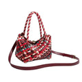 Women's casual woven PU leather shoulder bag showing handmade texture and shoulder strap.