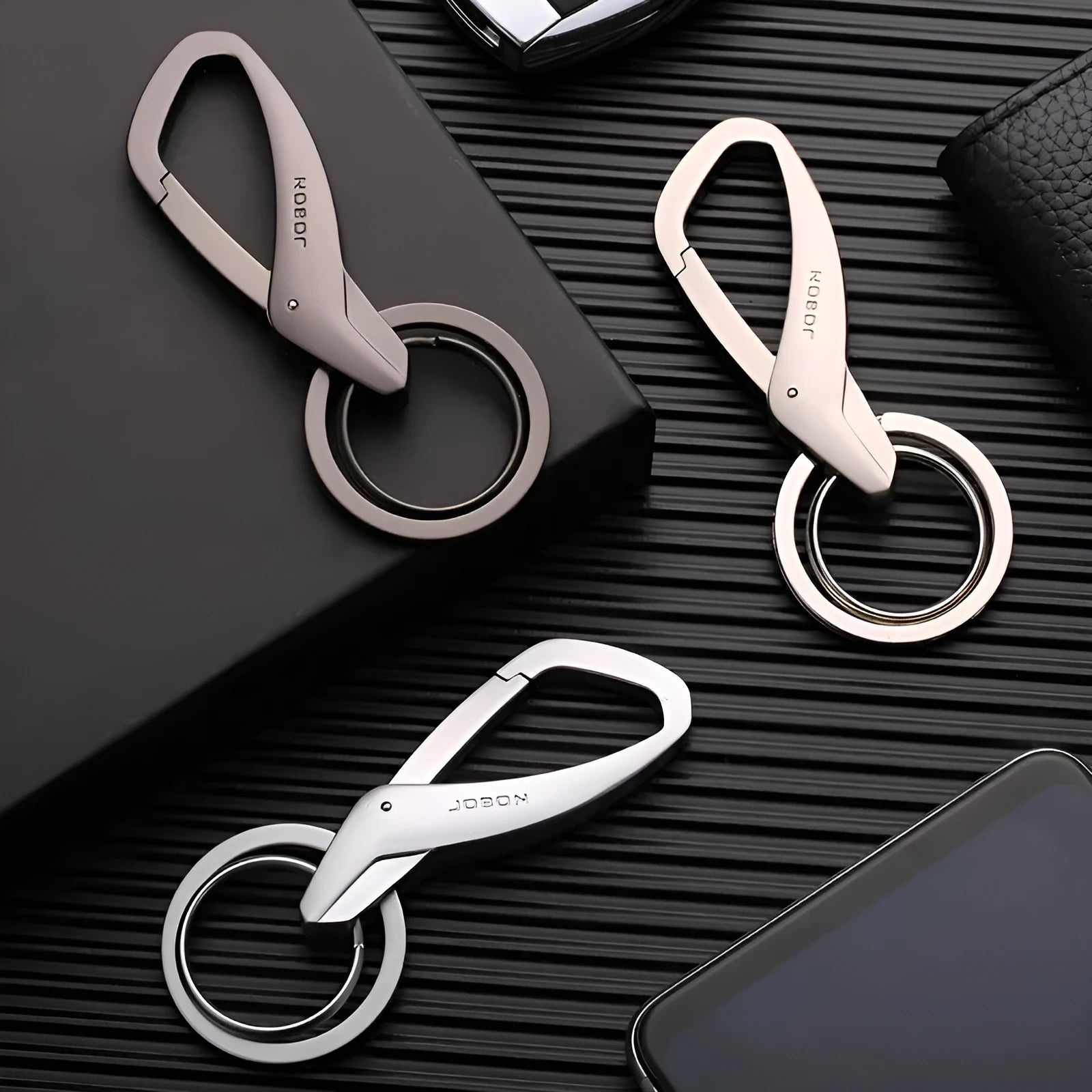 Zinc alloy double ring key holder with waist clip in black, chrome, and nickel finishes.