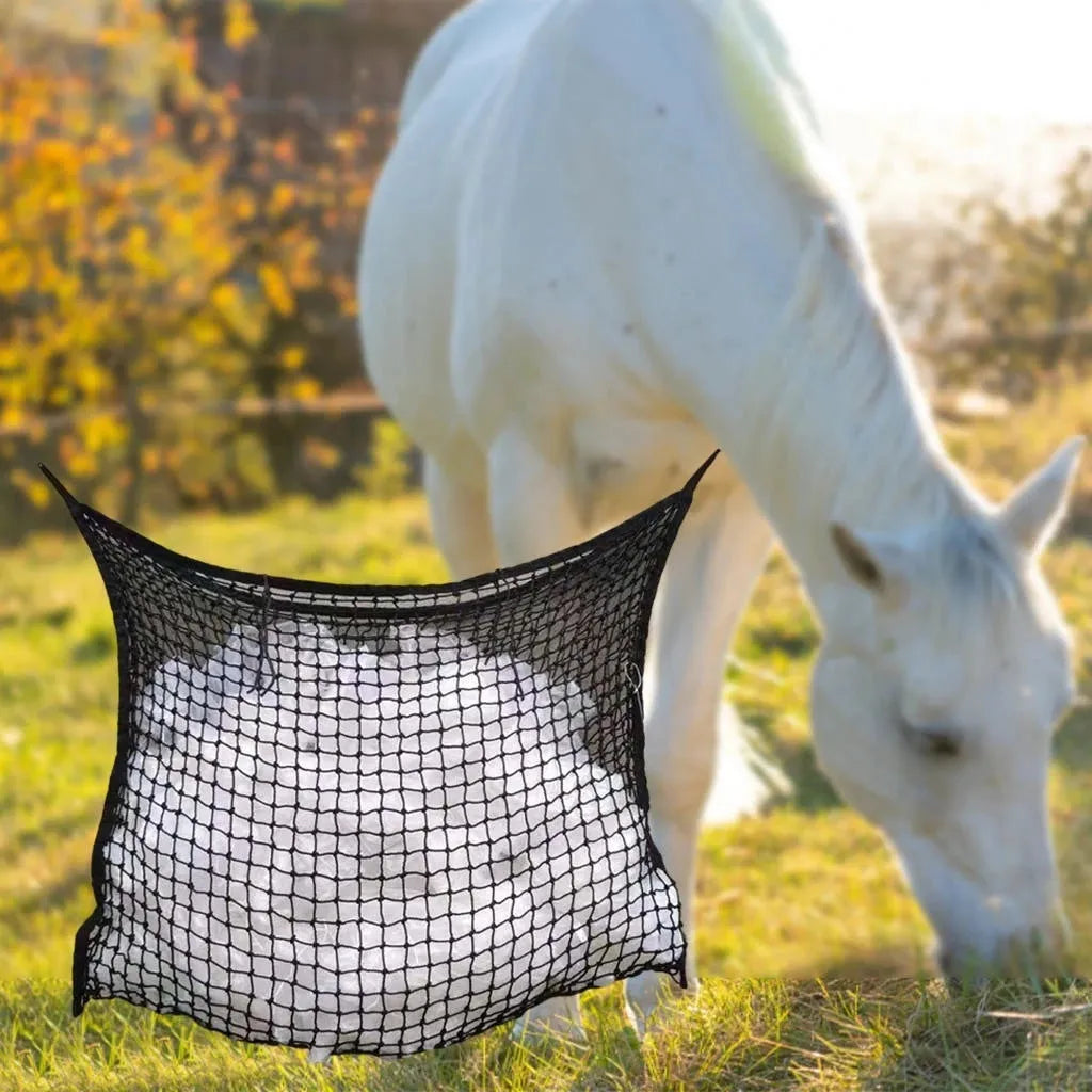 Black woven grid horse feeding bag hanging, showing its open structure and size.