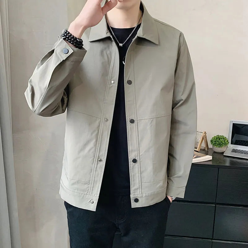 Man wearing a thin, grey, Korean-style long sleeve casual jacket for spring or autumn.