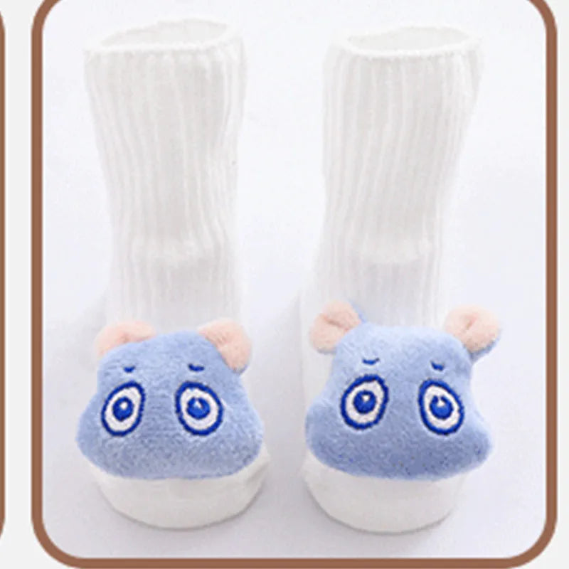 Cotton baby floor socks in a pink bow pattern, shown on an infant's feet.