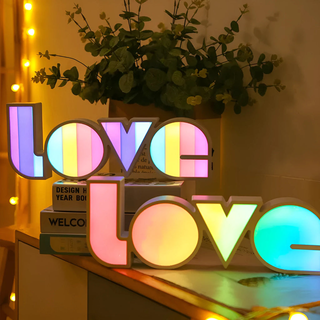Rainbow style LOVE word LED decorative light with USB cable, measuring 35.5cm by 13.5cm.