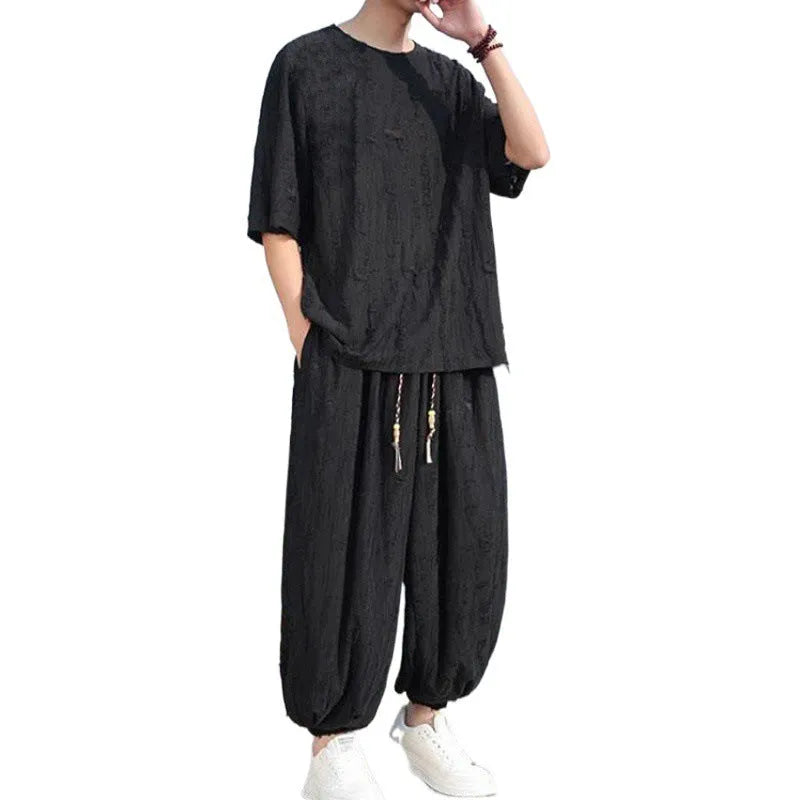 Men's thin black knitwear short-sleeve suit with cropped trousers on hanger