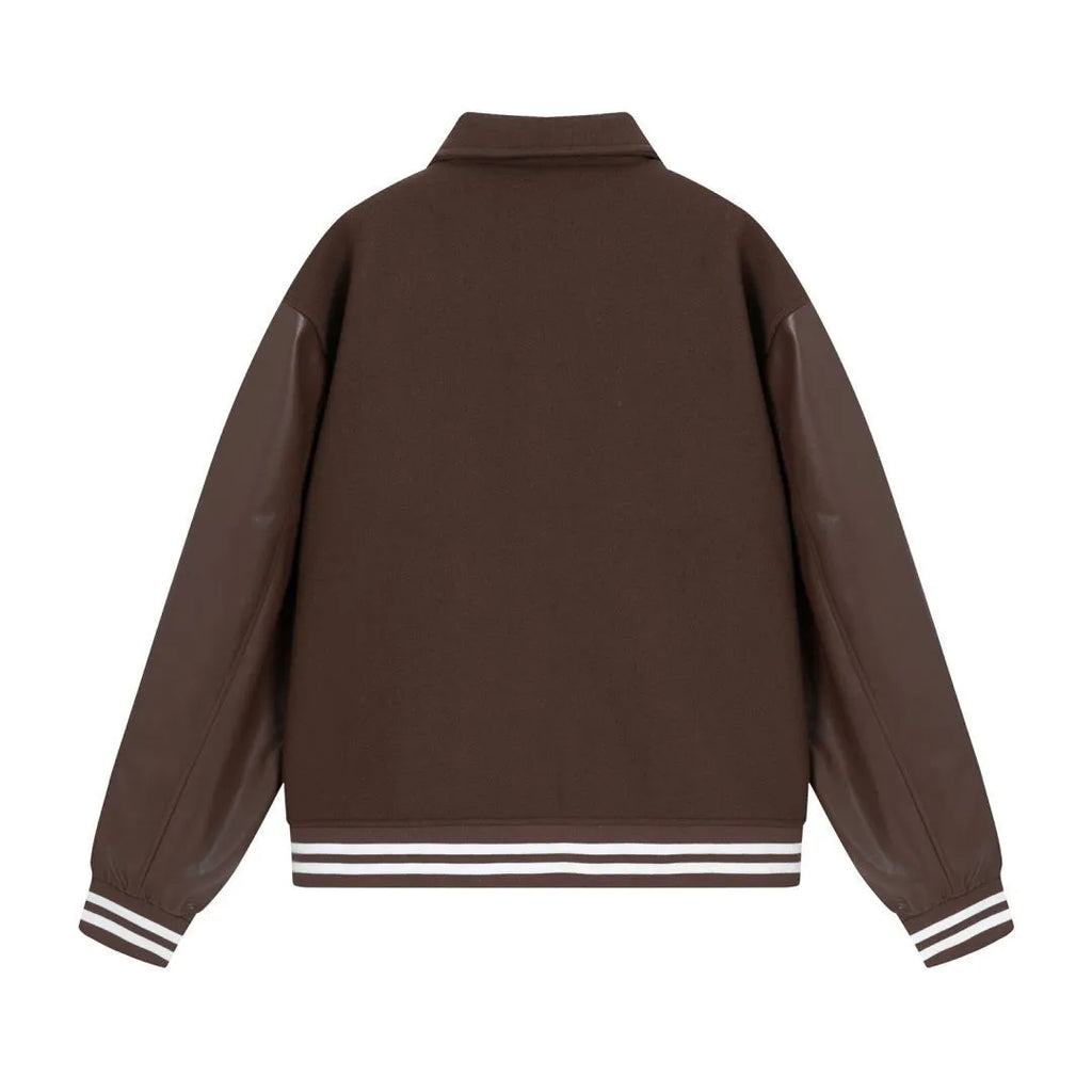 Women's apricot embroidered wool jacket with bone design detail on front.