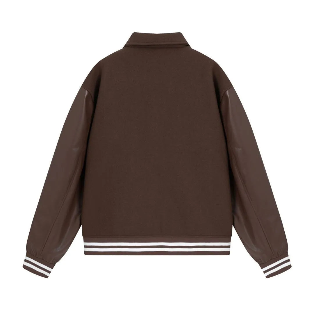 Women's apricot embroidered wool jacket with bone design detail on front.