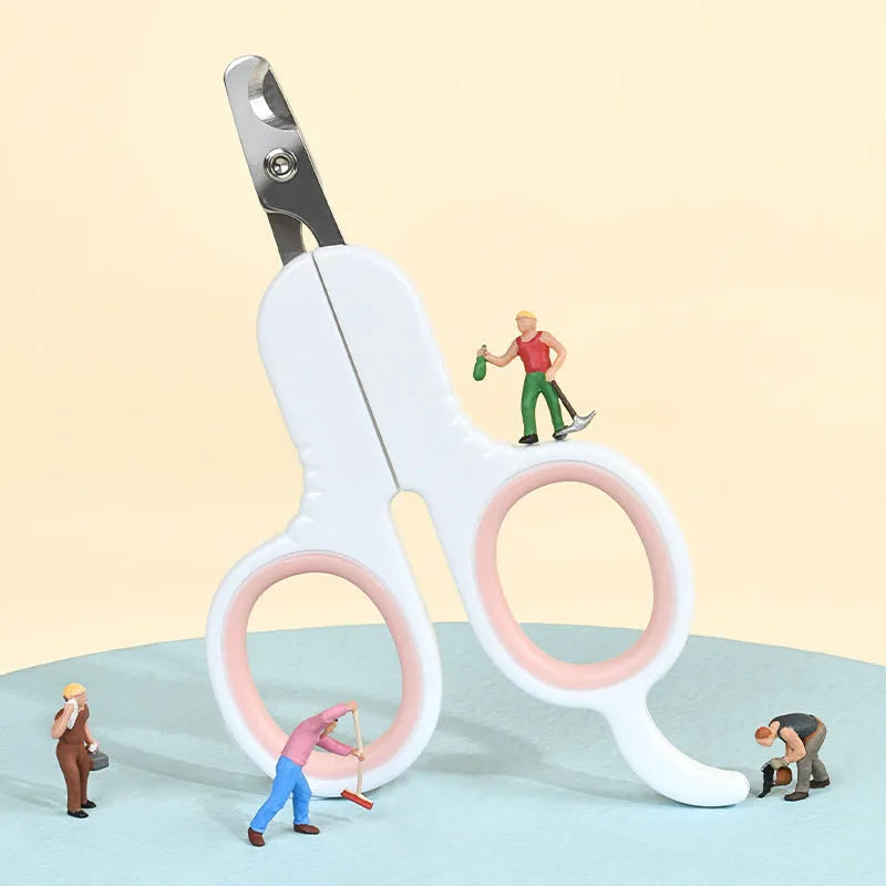 Grey and pink pet nail clippers with curved safety tips and a rubber-coated handle for trimming cat and small dog claws.