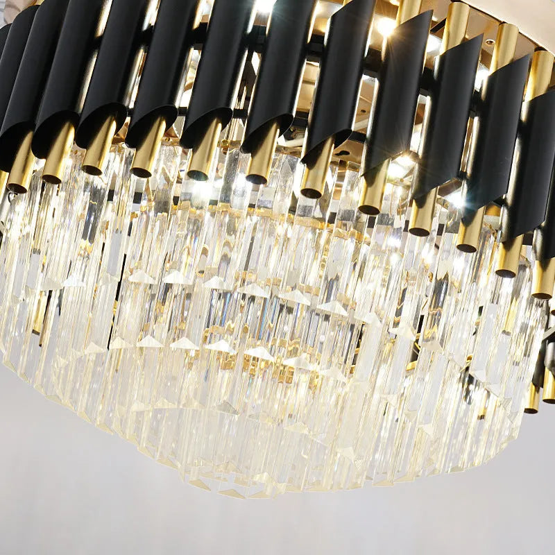 Crystal chandelier style ceiling fan with integrated LED light and remote control on a white ceiling.