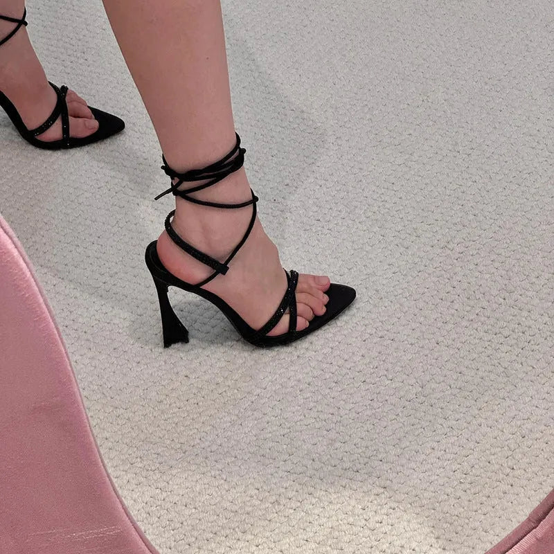 Black satin women's high heel sandals with 8cm heel and ankle strap.