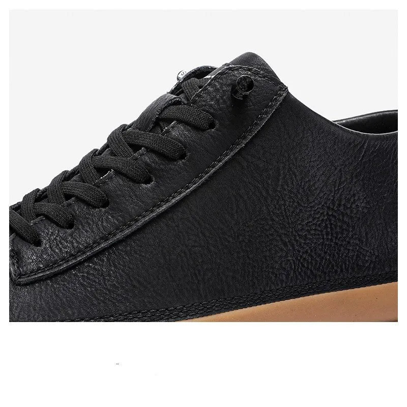 Men's black casual leather shoes with a round toe and lace-up front on a white background.