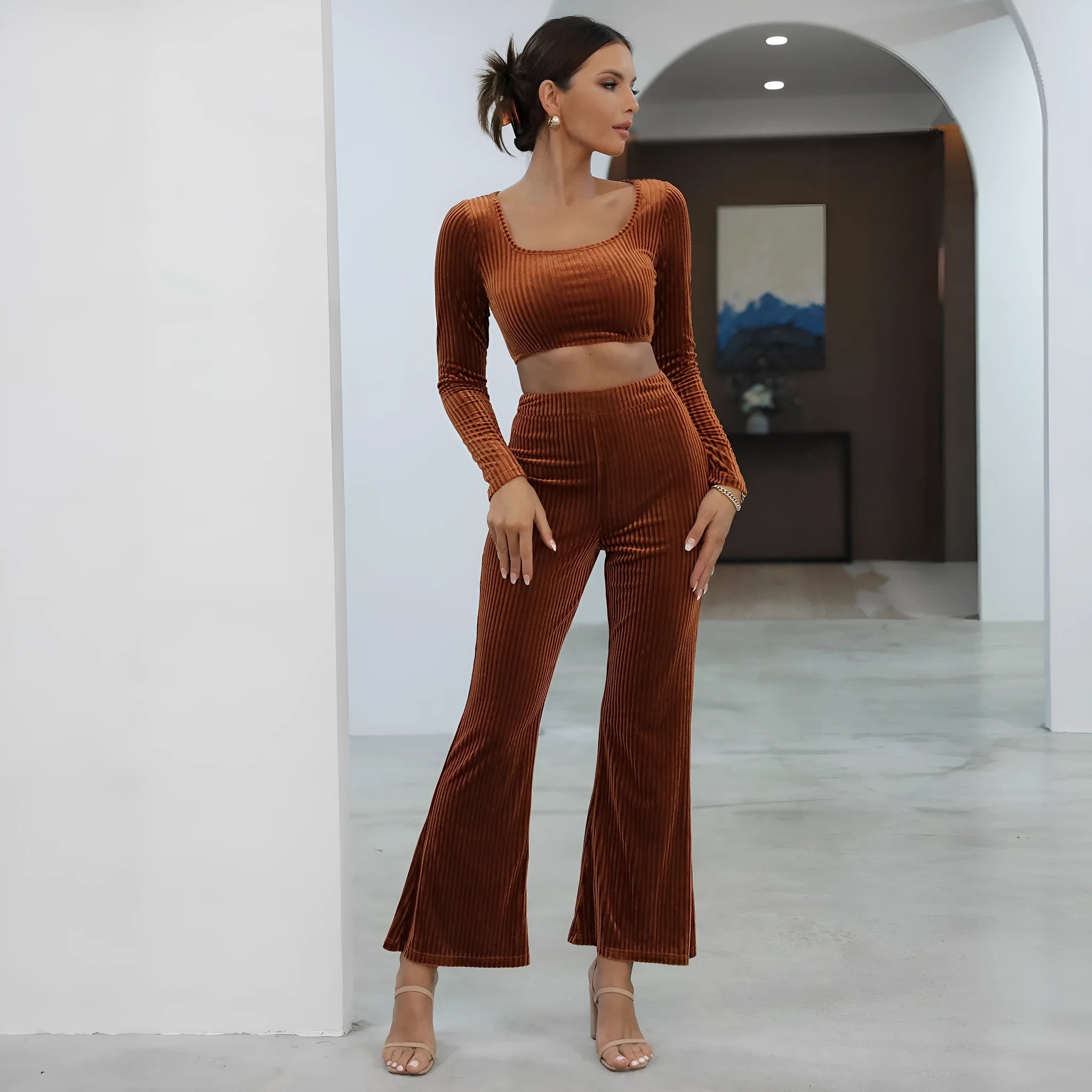 Caramel-coloured women's long sleeve sweater and trousers casual set on a hanger.