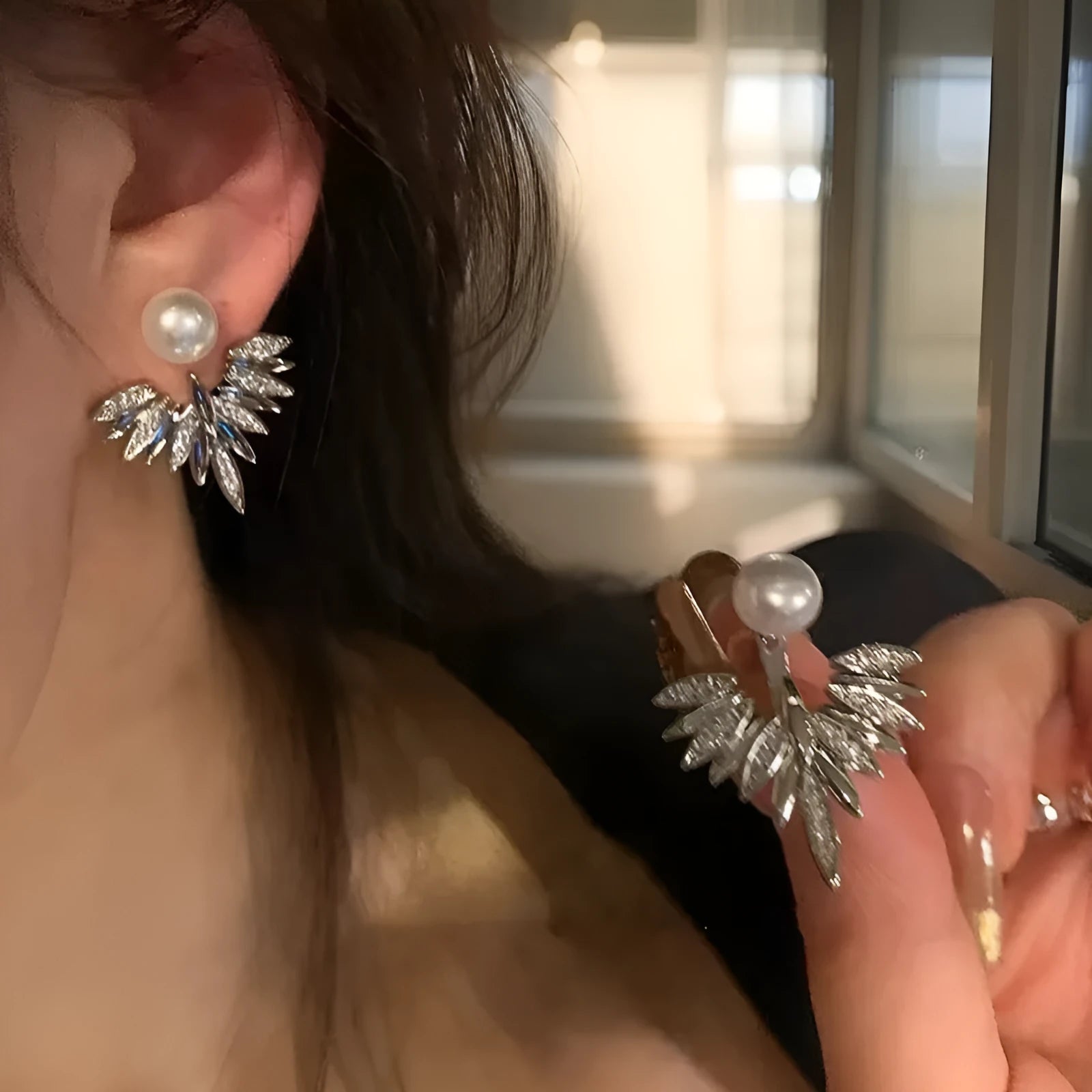 Silver ladies backward-hanging wing pearl earrings with diamond setting on alloy base