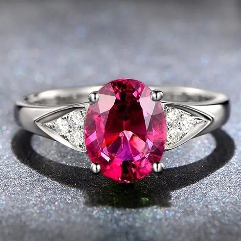 Women's court-style ring with a natural red or blue zircon stone in a heart, bell, or water drop pattern.