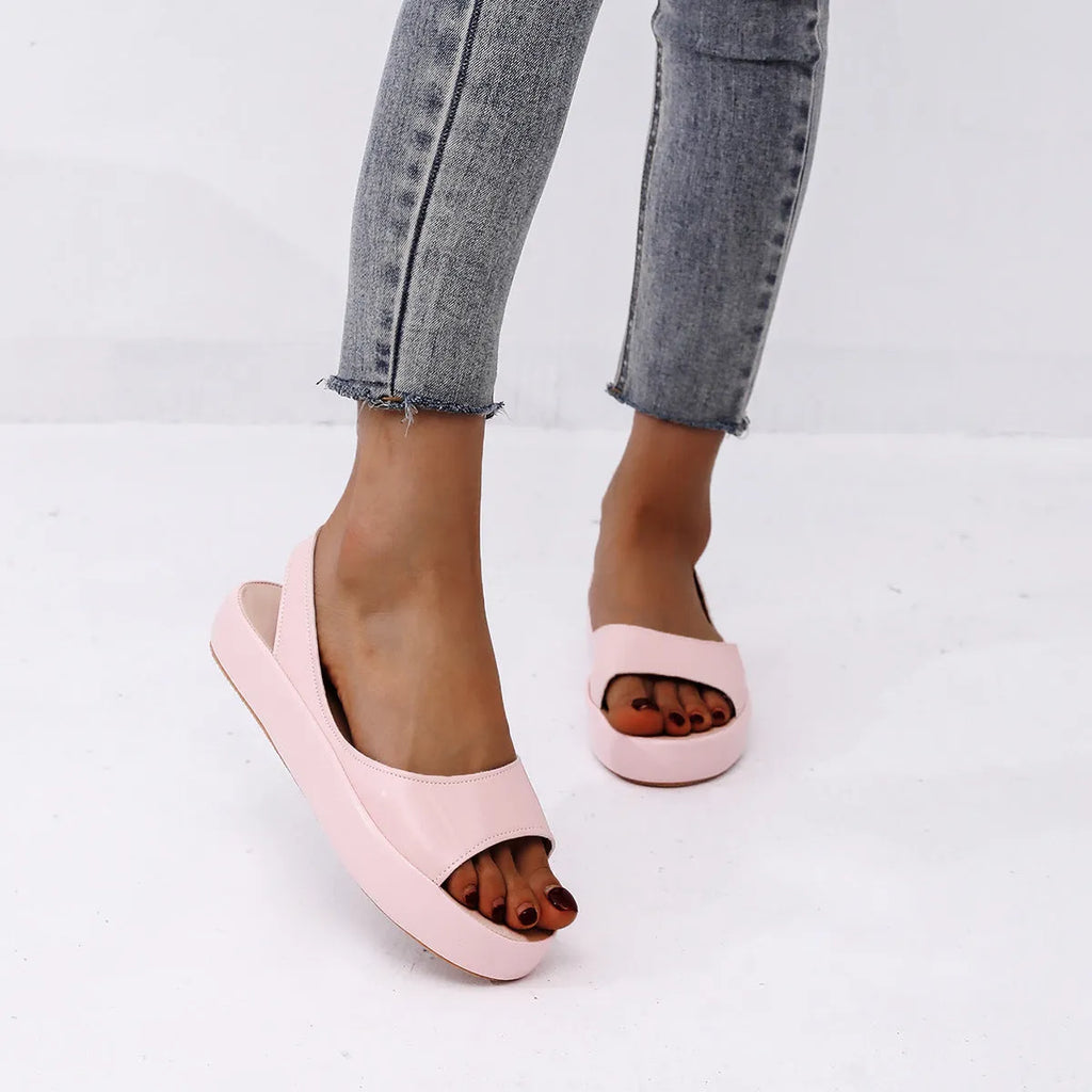 Women's summer fish mouth flat sandals in solid colour with back strap design, side hollow detail, artificial PU upper, rubber sole